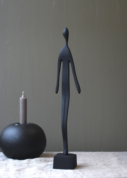 Skulptur man svart Store factory